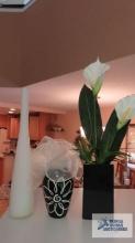 Three very different decorative vases and arrangements