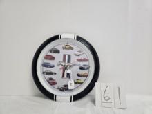 Round Plastic Batt Op Mustang Analog Clock Featuring 1964 Through 2013 As In