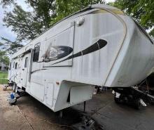 2010 COUGAR by Keystone 5th Wheel Camper toy hauler - has been parked for many years- look at