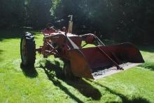 Farmall 'M' Tractor, narrow front, with loader with 6' trip bucket, 540 pto, 6.50-16 fronts, 14.9-38