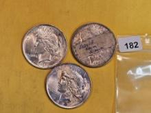 Three mixed Silver Dollars