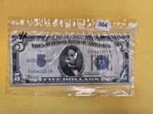 Four $5 silver certificates in Very Fine to Extra Fine