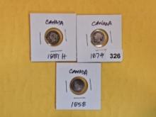 Three earlier, silver, Canada 5 cent coins