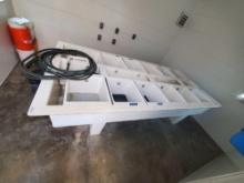 Table setup with pvc and12 fiberglass bins for oyster nursery