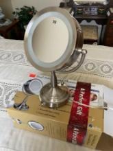 Brand new still in box round mirror great for a gift or to keep