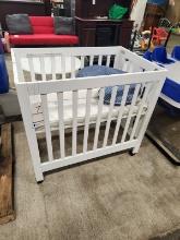 COLLAPSIBLE WOODEN CRIB ON WHEELS 39" X 25.5" X 36"