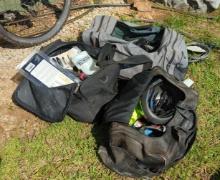 3 bags of cycling gear including Specialized cycling shoes(size11), helmets, bike locks and more