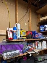 contents of shelf above tool bench, oil, mouse traps, tools, and more