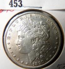 1890 P Morgan Silver Dollar, Almost Uncirculated.