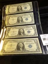 Series 1935D, 1935E, 1957, & 1957A One Dollar Silver Certificates in a plastic page.