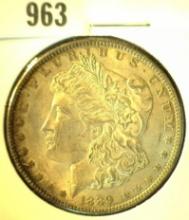 1889 P Morgan Silver Dollar with Natural toning. AU+.