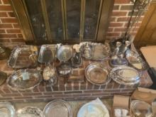 19 PIECES OF SILVERPLATE ON THE HEARTH