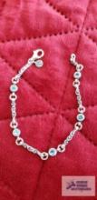 Silver colored bracelet with blue stones marked 925 10.3 G (Description provided by seller)