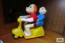 vintage dogs riding scooter plastic push toy