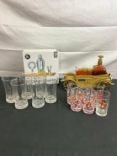 Collection of 12 Olympics Glasses w/ Music Box Cadillac Decanter & Shot glasses +Shaker Set