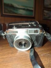(LR) YASHICA EZ-MATIC CAMERA, APPEARS TO HAVE BATTERY CORROSION, COMES IN PROTECTIVE CASE.