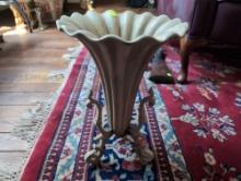 (LR) VINTAGE CREAM COLORED CAST IRON RUFFLED FLOWER VASE ON THREE DETAILED LEGS. SUBSTANTIAL WEIGHT.