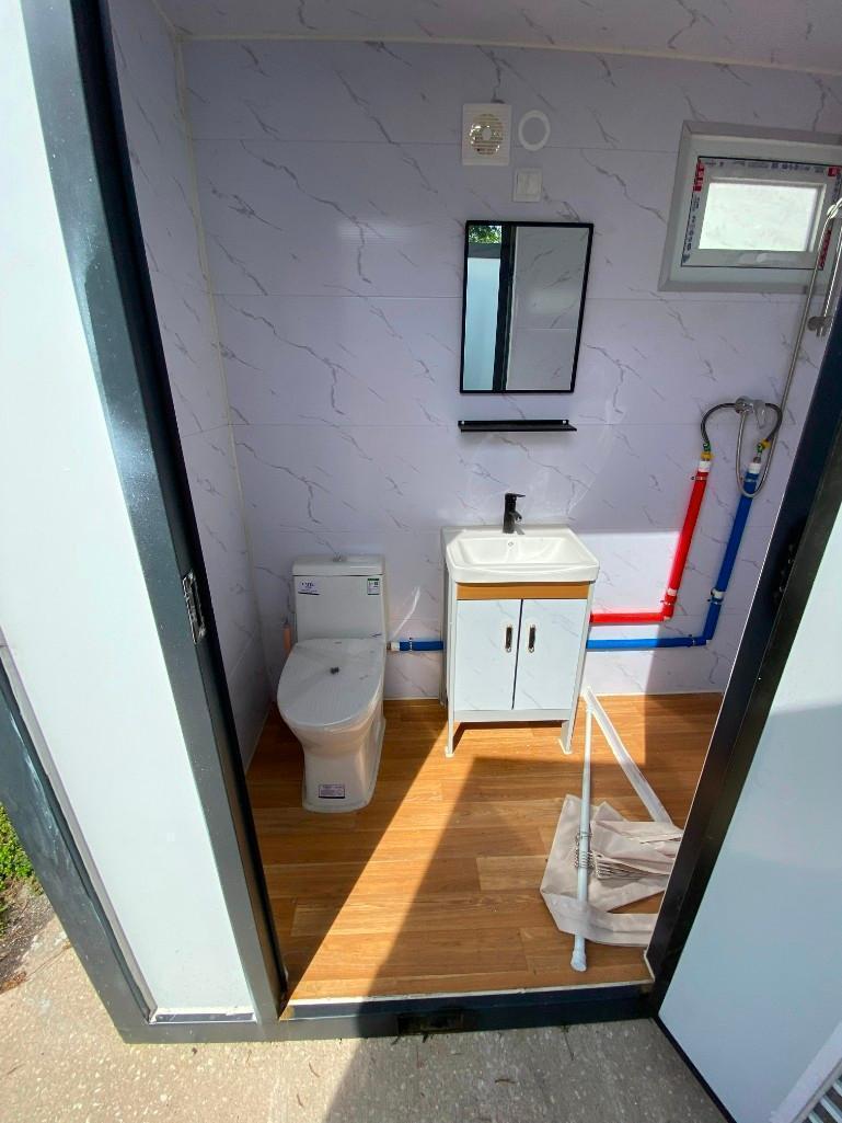 UNUSED PORTABLE BATHROOM WITH SHOWER, SINK, MIRROR, TOILET, TOILET PAPER HOLDER, LIGHTS, APPROX 4...