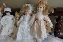 8 PORCELAIN HEADED DOLLS APPROX 15" TALL