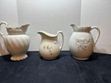 three stoneware pitchers