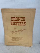 Pair of Frederic Remington bronco busters lithographs, and folder