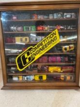 Hot Wheel and Hot Wheel type cars in display case