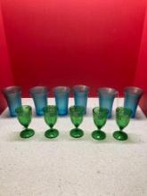 five Emerald green handpainted, paneled cordials, and six blue stretch tumblers