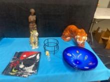 ceramic tiger, ceramic leopard, two sports flags, wooden Venus de Milo statue, hand blown glass