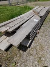 Large stack of rough cut lumber