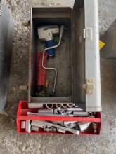 Tool box with large socket wrenches with sockets and an air impact