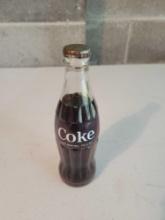 Coca-Cola bottle with misprint sprite cap