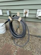 Four flexible garden hoses