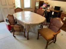 Wooden table with chairs and extra table leaf