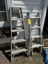 two aluminum ladders